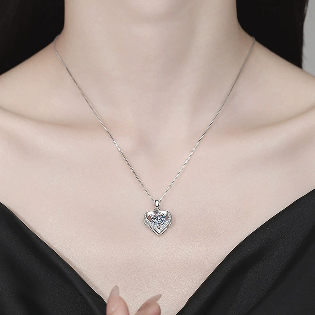 Heart Moissanite Pendant Necklace with Cubic Zirconia in Platinum-Plated S925 Sterling Silver worn on neckline by model