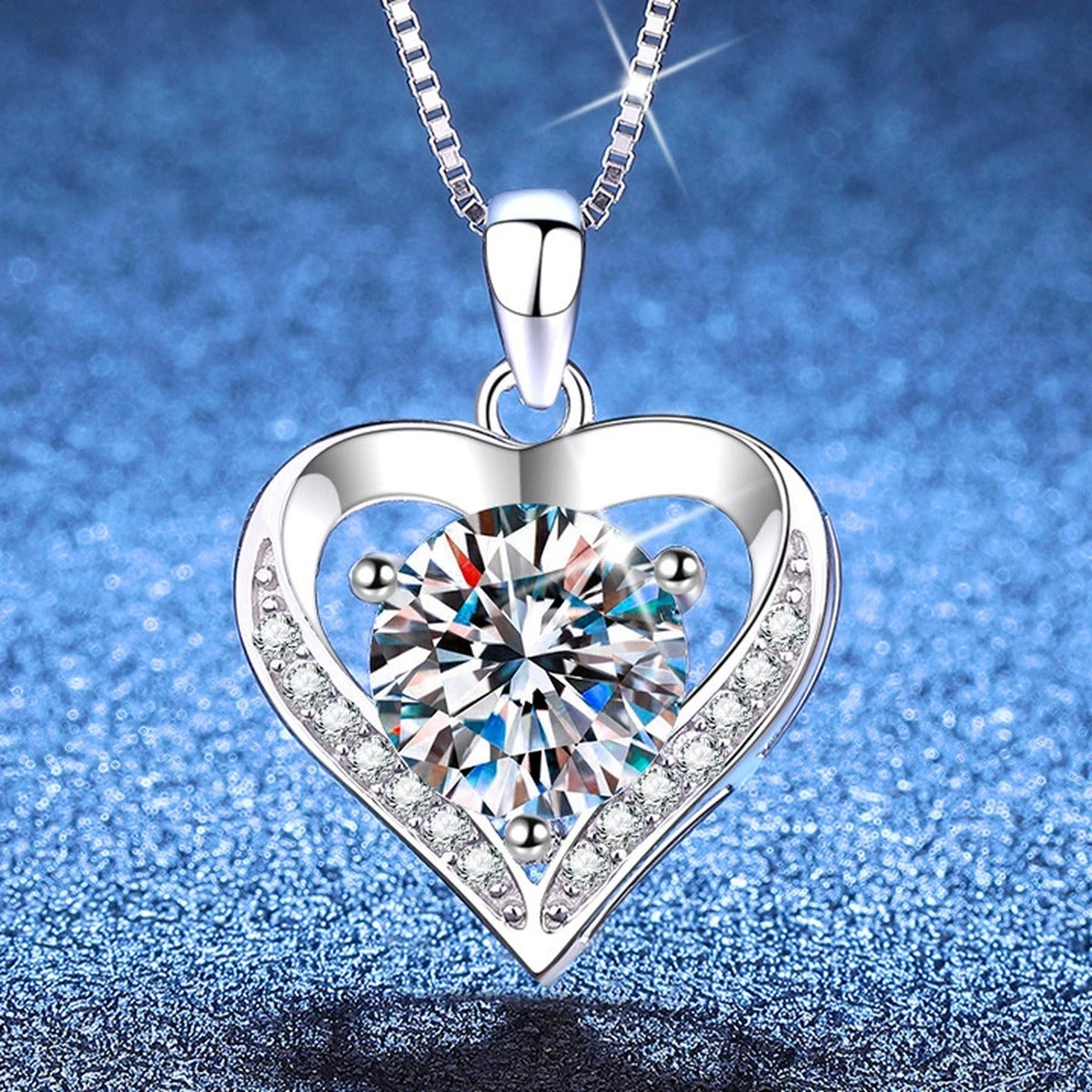 Heart Moissanite Pendant Necklace with Cubic Zirconia in Platinum-Plated S925 Sterling Silver blue background angled view
