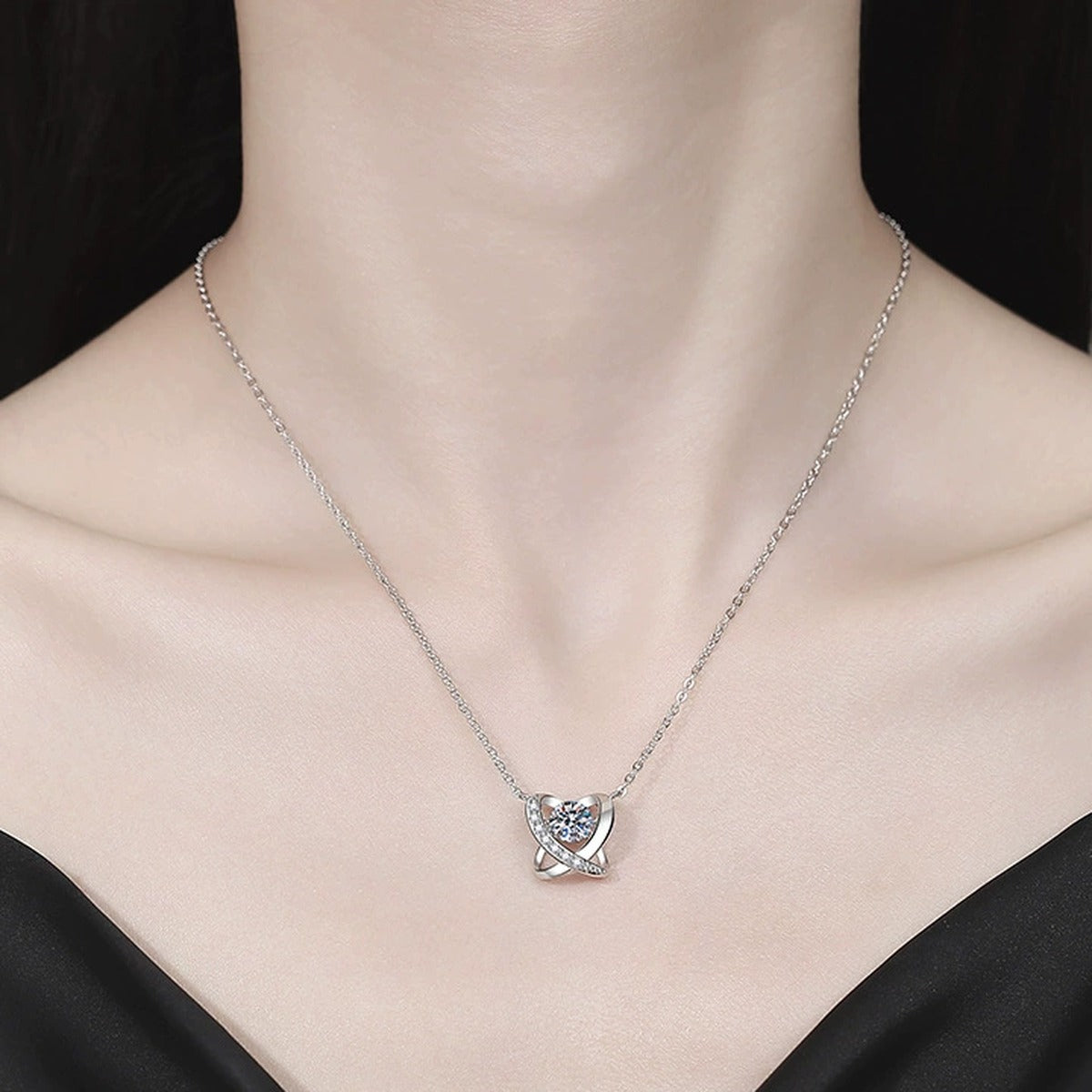 Swirl Halo Moissanite Pendant Necklace with Cubic Zirconia in Platinum-Plated S925 Sterling Silver worn on neckline by model