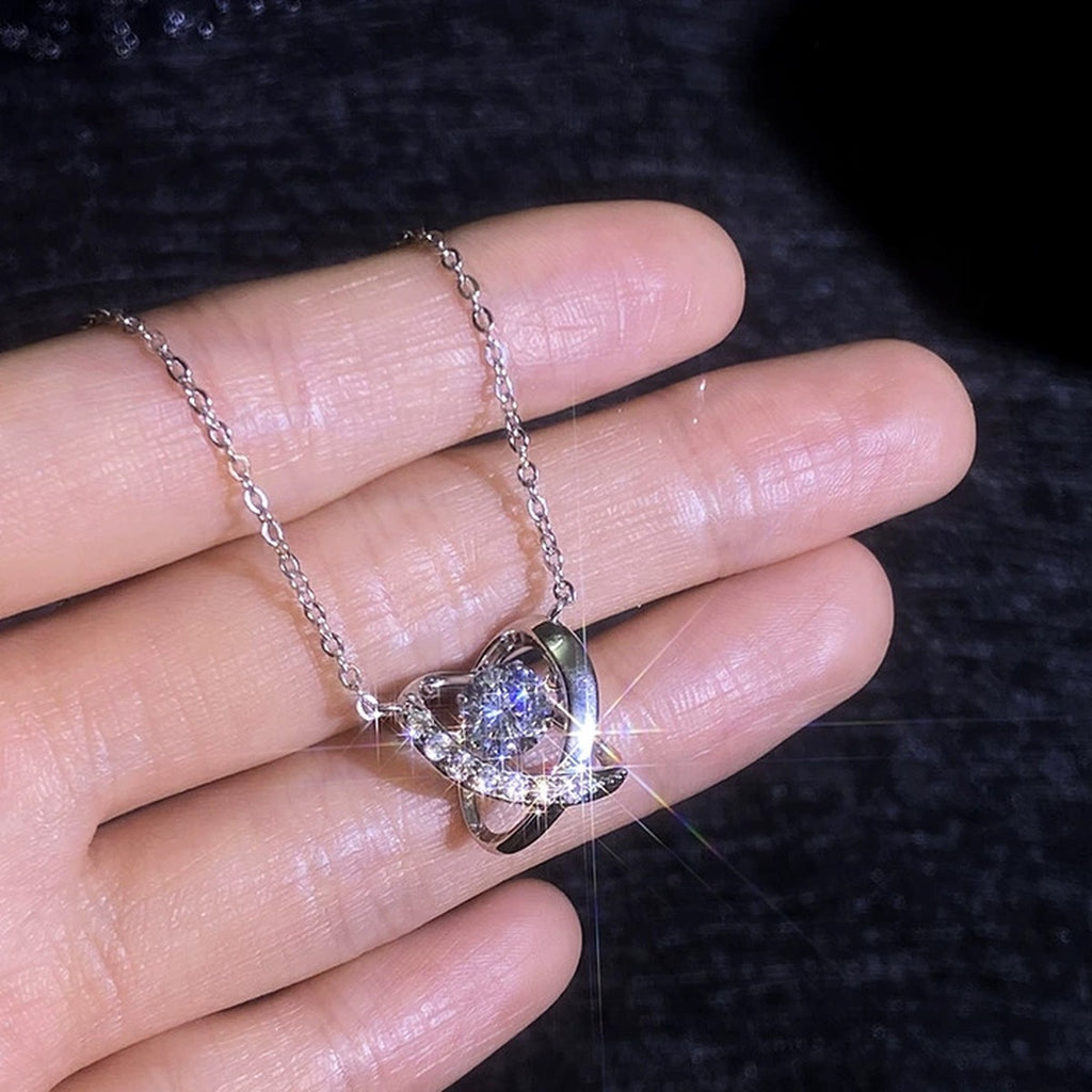 Swirl Halo Moissanite Pendant Necklace with Cubic Zirconia in Platinum-Plated S925 Sterling Silver worn on neckline by model