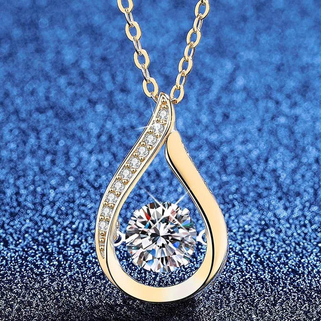 Teardrop Moissanite Pendant Necklace with Cubic Zirconia in 18K Yellow Gold-Plated S925 Sterling Silver blue background angled view