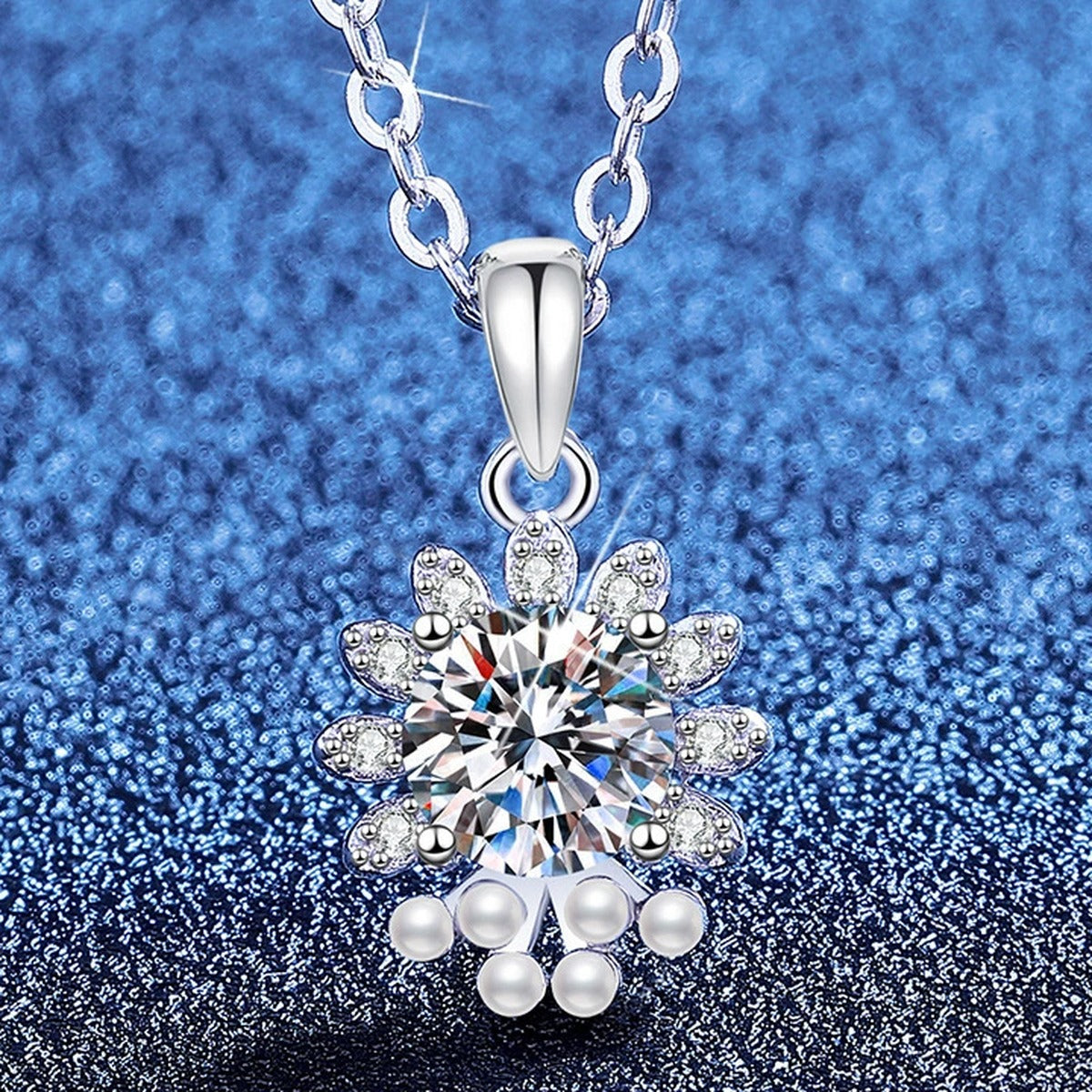Snowflake Moissanite Pendant Necklace with Cubic Zirconia in Platinum-Plated S925 Sterling Silver blue background angled view