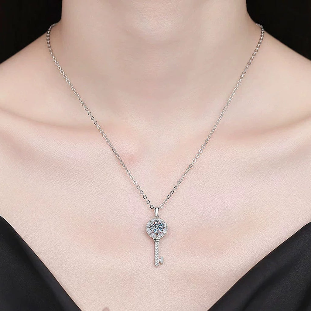 Teardrop Halo Moissanite Pendant Necklace with Cubic Zirconia in Platinum-Plated S925 Sterling Silver worn on neckline by model