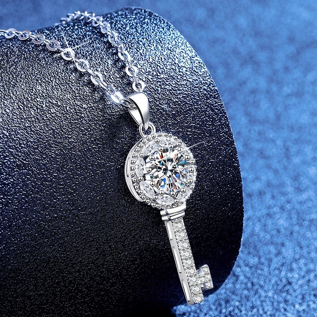 Teardrop Halo Moissanite Pendant Necklace with Cubic Zirconia in Platinum-Plated S925 Sterling Silver blue background product view
