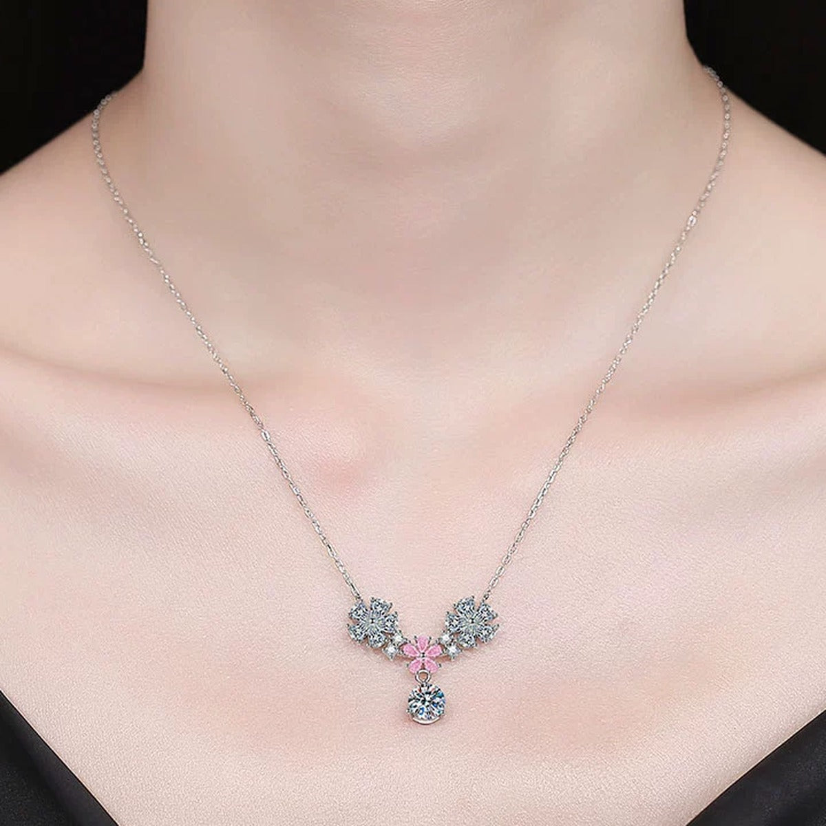 Floral Moissanite Pendant Necklace with Pink Cubic Zirconia in Platinum-Plated S925 Sterling Silver worn on neckline by model