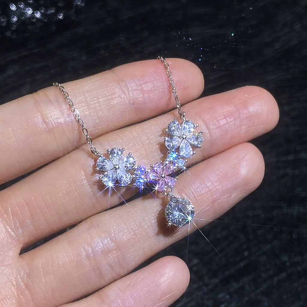 Floral Moissanite Pendant Necklace with Pink Cubic Zirconia in Platinum-Plated S925 Sterling Silver worn on neckline by model