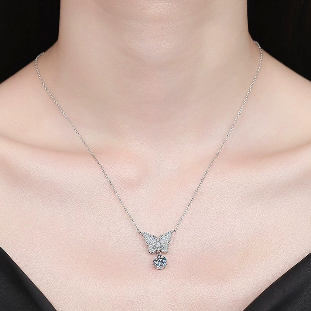Butterfly Moissanite Pendant Necklace with Cubic Zirconia in Platinum-Plated S925 Sterling Silver worn on neckline by model