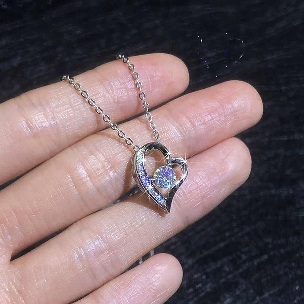 Heart Knot Moissanite Pendant Necklace with Cubic Zirconia in Platinum-Plated S925 Sterling Silver worn on neckline by model