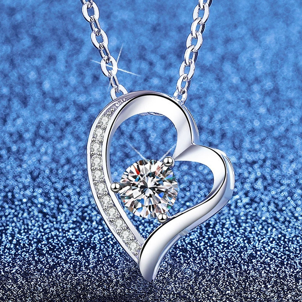 Heart Knot Moissanite Pendant Necklace with Cubic Zirconia in Platinum-Plated S925 Sterling Silver blue background product view
