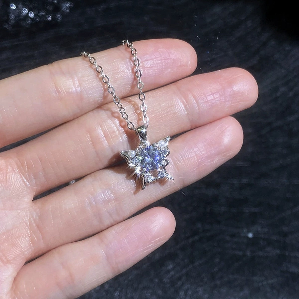 Floral Moissanite Pendant Necklace with Cubic Zirconia and Pearl in Platinum-Plated S925 Sterling Silver worn on neckline by model