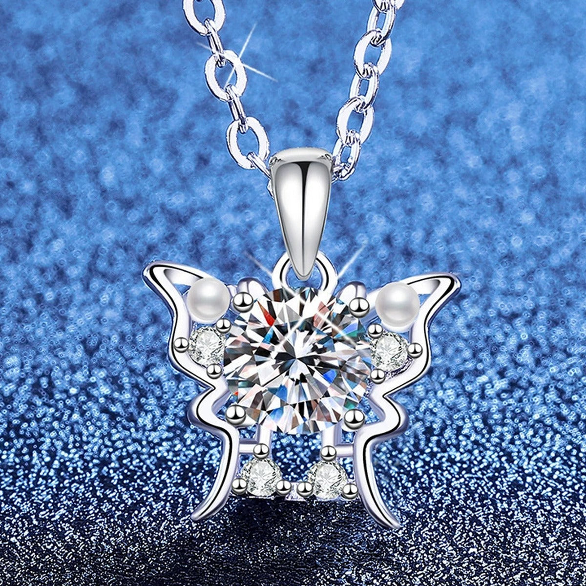 Floral Moissanite Pendant Necklace with Cubic Zirconia and Pearl in Platinum-Plated S925 Sterling Silver blue background angled view