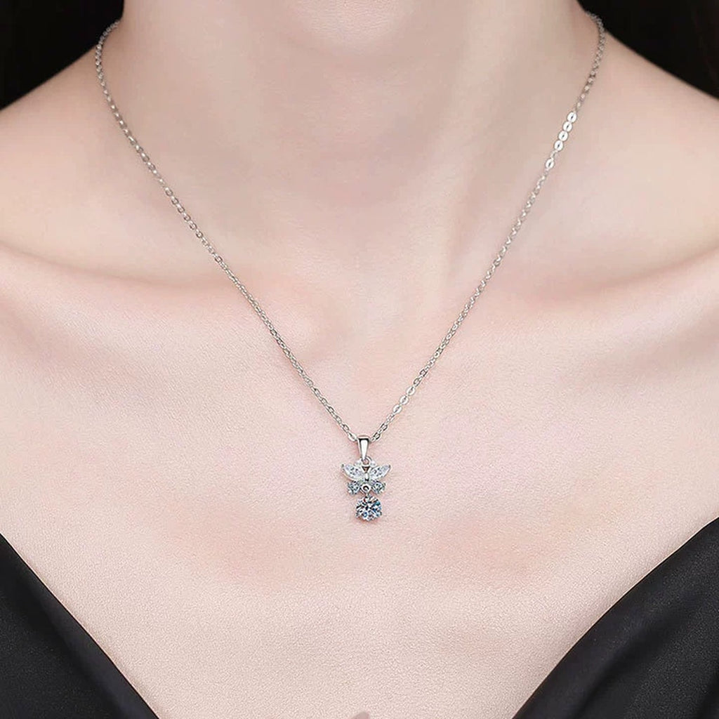 Star Cross Moissanite Pendant Necklace with Cubic Zirconia in Platinum-Plated S925 Sterling Silver worn on neckline by model