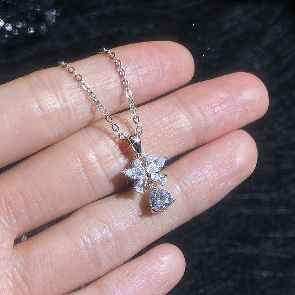 Star Cross Moissanite Pendant Necklace with Cubic Zirconia in Platinum-Plated S925 Sterling Silver worn on neckline by model