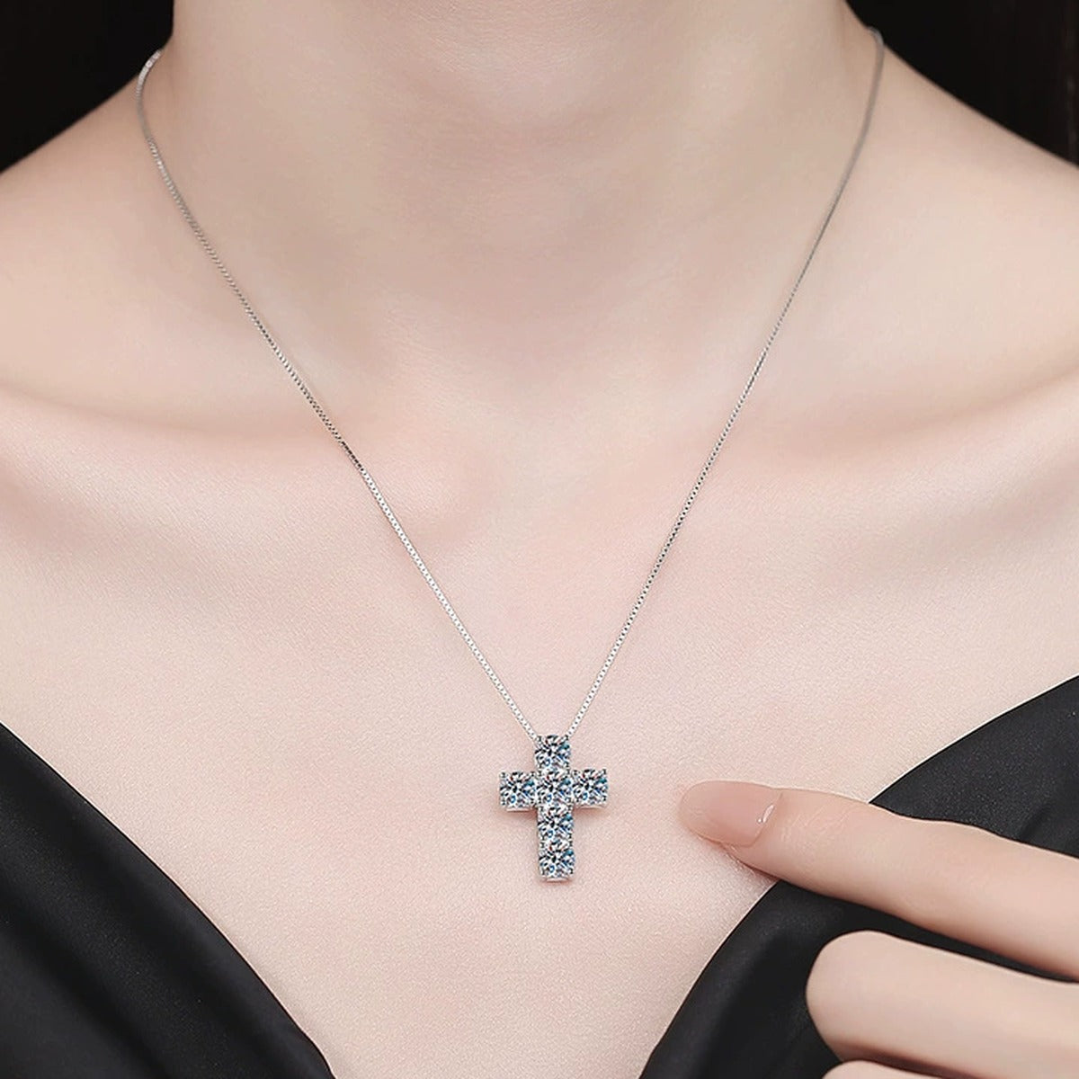 Cross Moissanite Pendant Necklace in Platinum-Plated S925 Sterling Silver worn on neckline by model