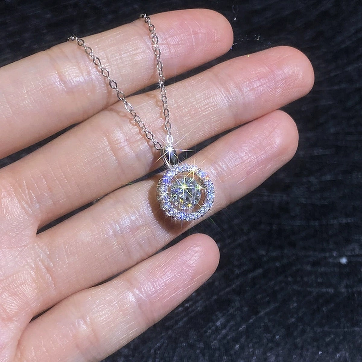 Round Halo Moissanite Pendant Necklace with Cubic Zirconia in Platinum-Plated S925 Sterling Silver worn on neckline by model