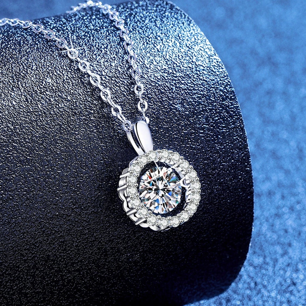 Round Halo Moissanite Pendant Necklace with Cubic Zirconia in Platinum-Plated S925 Sterling Silver blue background product view