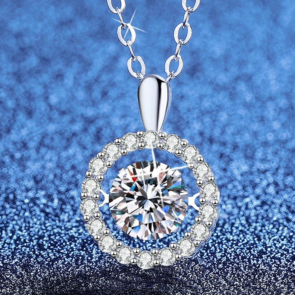 Round Halo Moissanite Pendant Necklace with Cubic Zirconia in Platinum-Plated S925 Sterling Silver blue background angled view