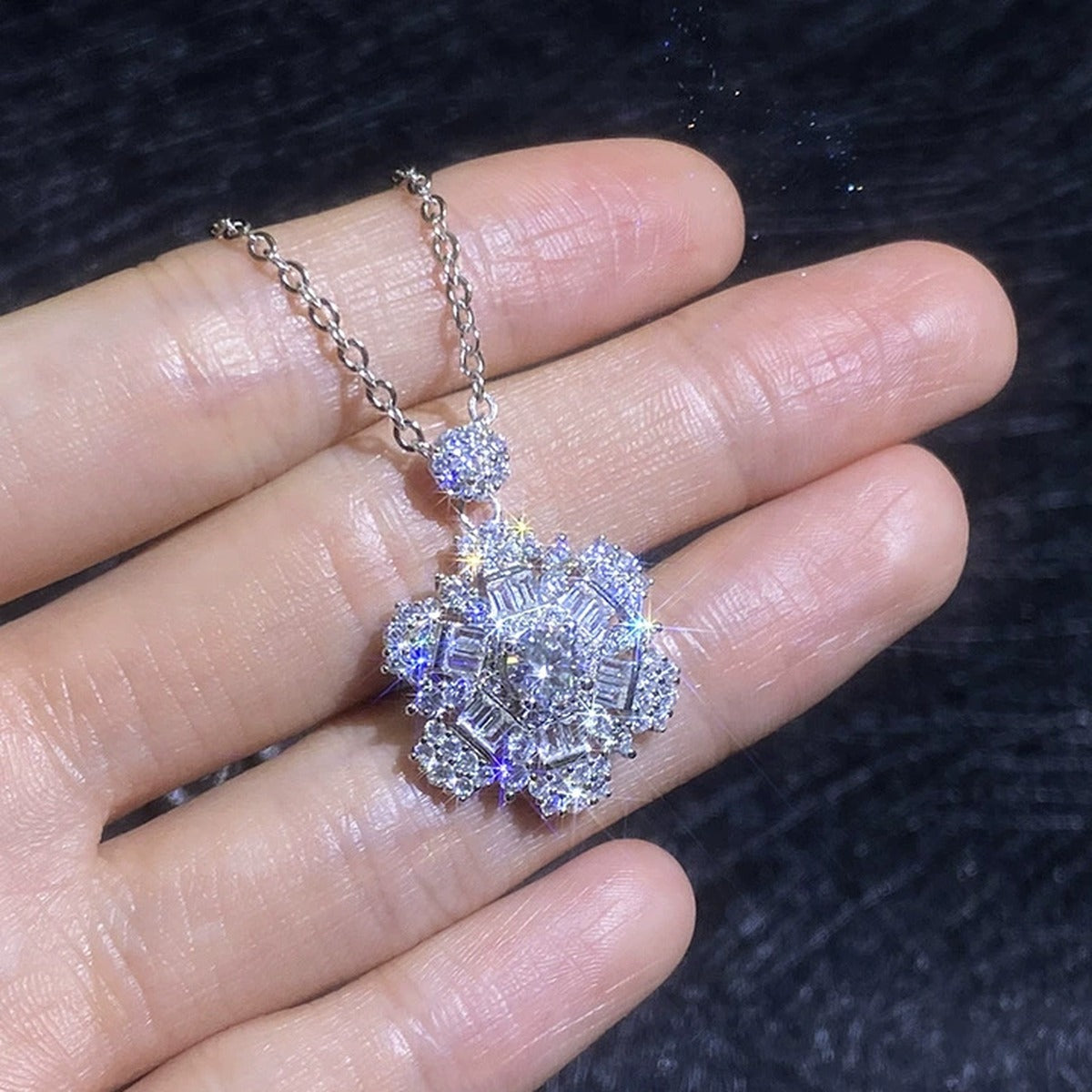 Snowflake Moissanite Pendant Necklace with Cubic Zirconia in Platinum-Plated S925 Sterling Silver worn on neckline by model