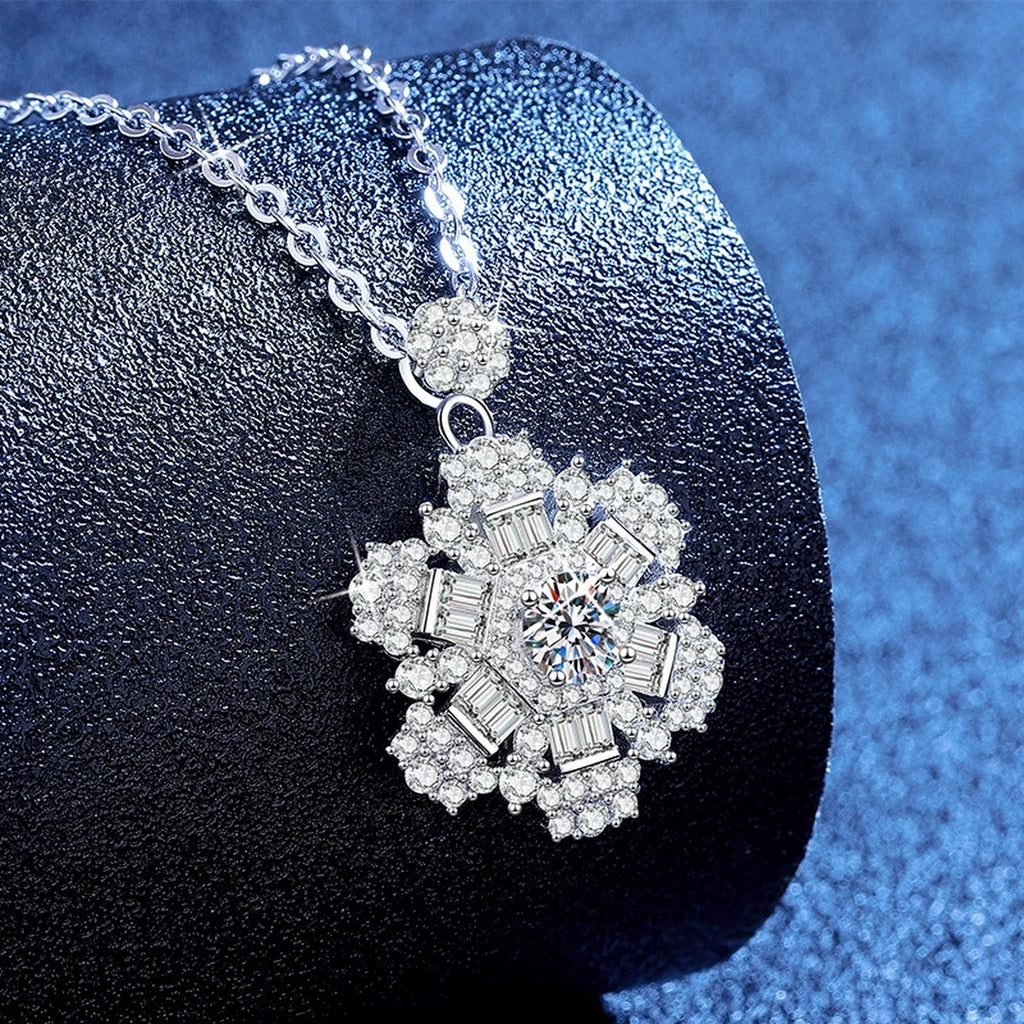 Snowflake Moissanite Pendant Necklace with Cubic Zirconia in Platinum-Plated S925 Sterling Silver blue background angled view