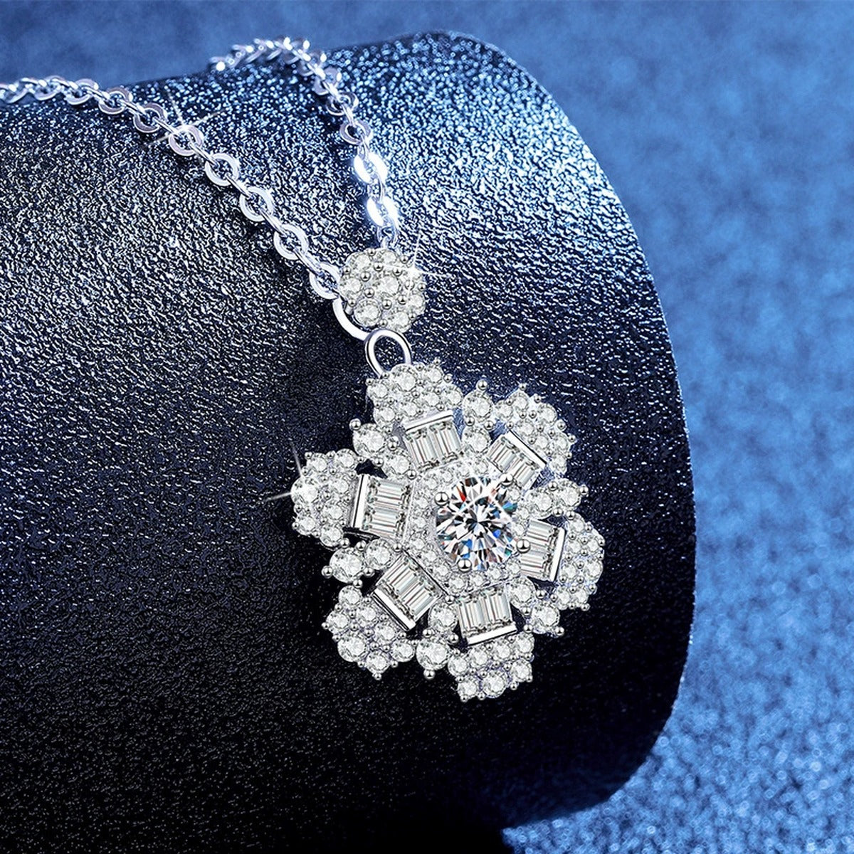 Snowflake Moissanite Pendant Necklace with Cubic Zirconia in Platinum-Plated S925 Sterling Silver blue background angled view