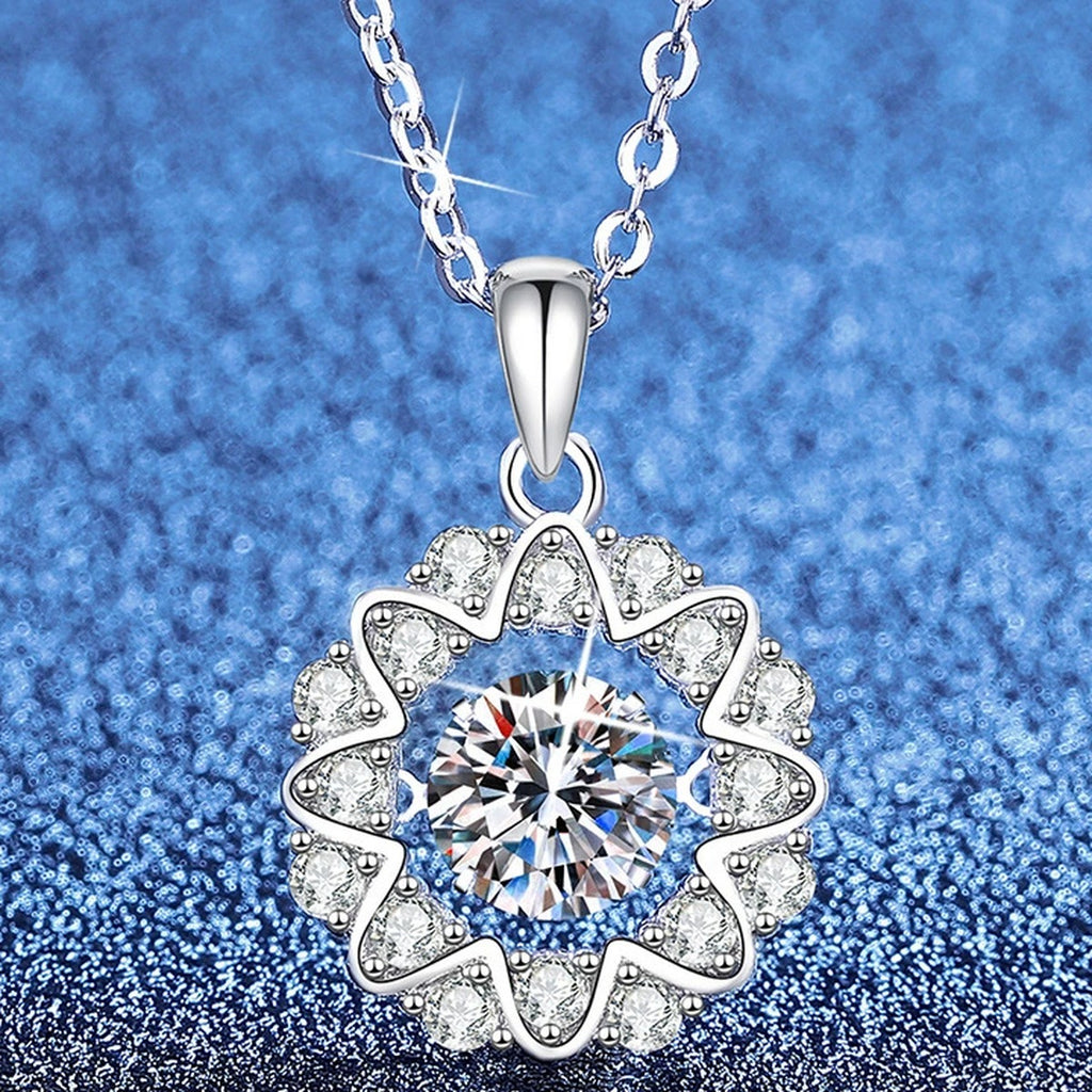 Floral Halo Moissanite Pendant Necklace with Cubic Zirconia in Platinum-Plated S925 Sterling Silver blue background angled view