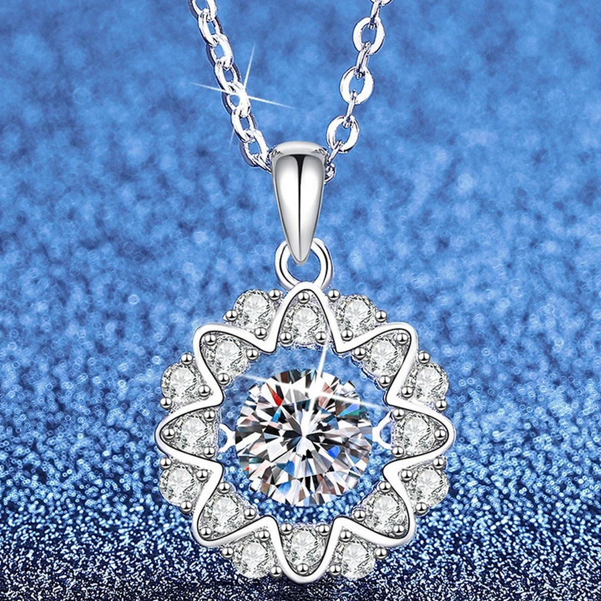 Floral Halo Moissanite Pendant Necklace with Cubic Zirconia in Platinum-Plated S925 Sterling Silver blue background angled view