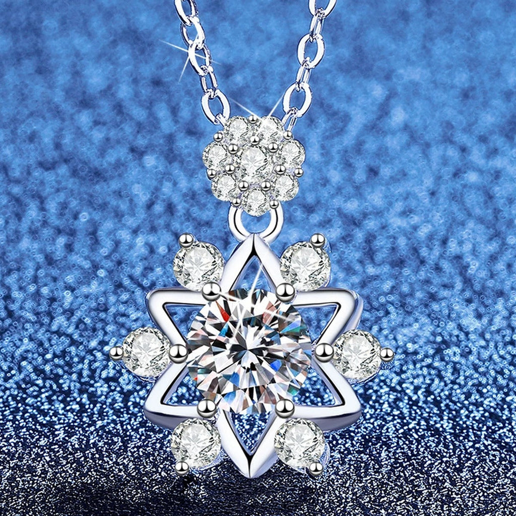 Starburst Moissanite Pendant Necklace with Cubic Zirconia in Platinum-Plated S925 Sterling Silver blue background angled view