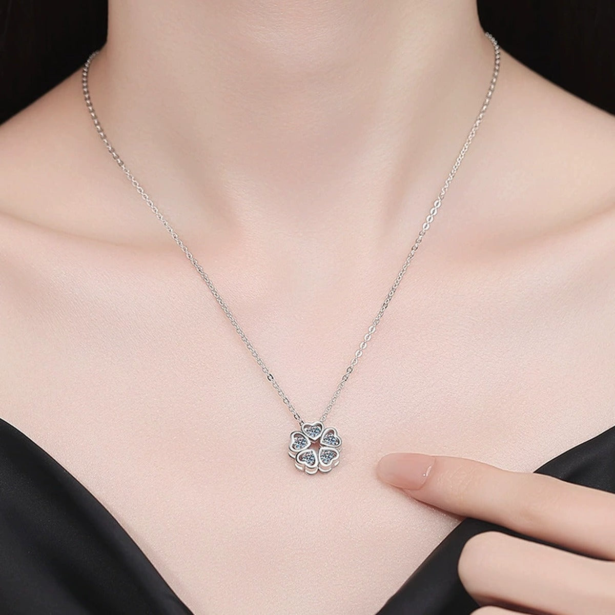 Clover Moissanite Pendant Necklace in Platinum-Plated S925 Sterling Silver worn on neckline by model