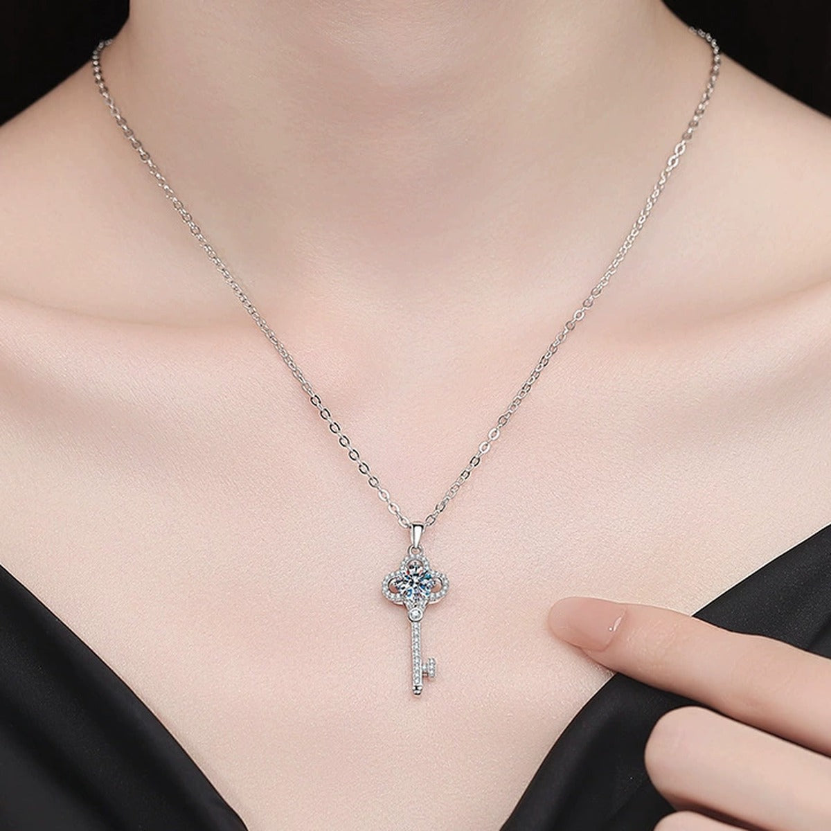 Cross Moissanite Pendant Necklace with Cubic Zirconia in Platinum-Plated S925 Sterling Silver worn on neckline by model