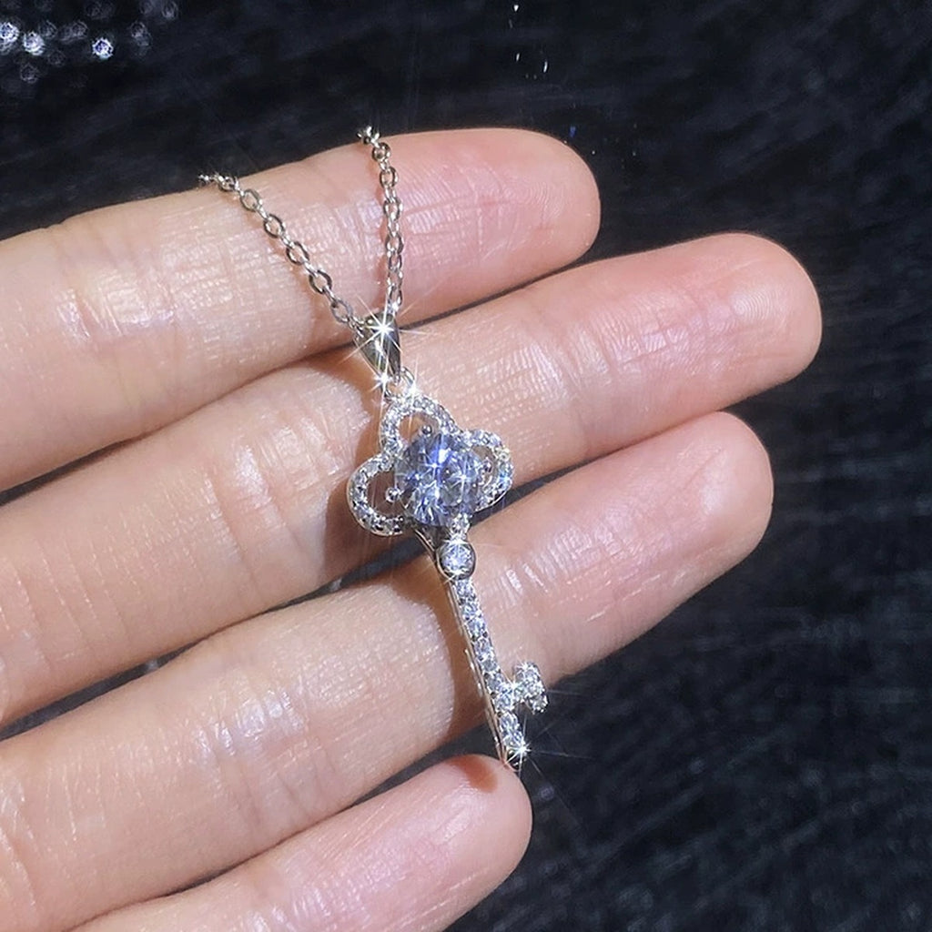 Cross Moissanite Pendant Necklace with Cubic Zirconia in Platinum-Plated S925 Sterling Silver worn on neckline by model