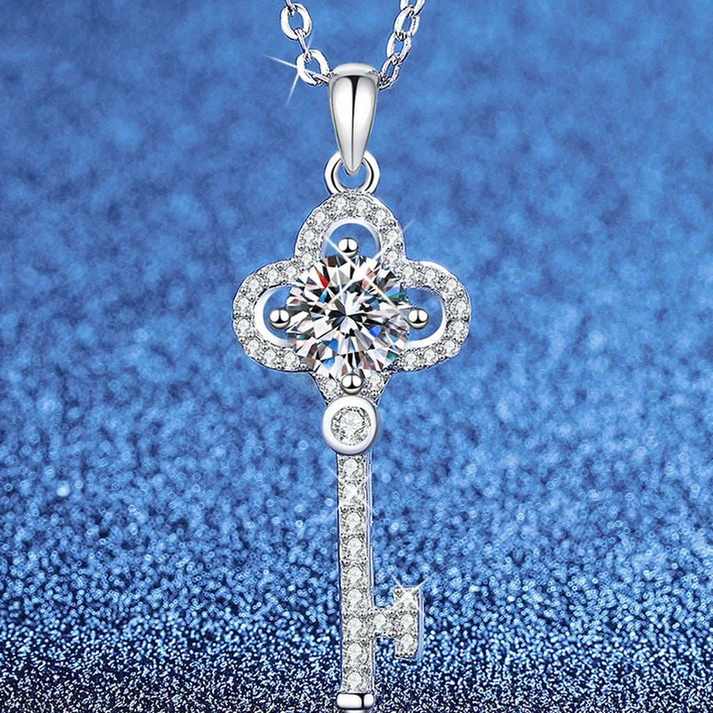 Cross Moissanite Pendant Necklace with Cubic Zirconia in Platinum-Plated S925 Sterling Silver blue background angled view