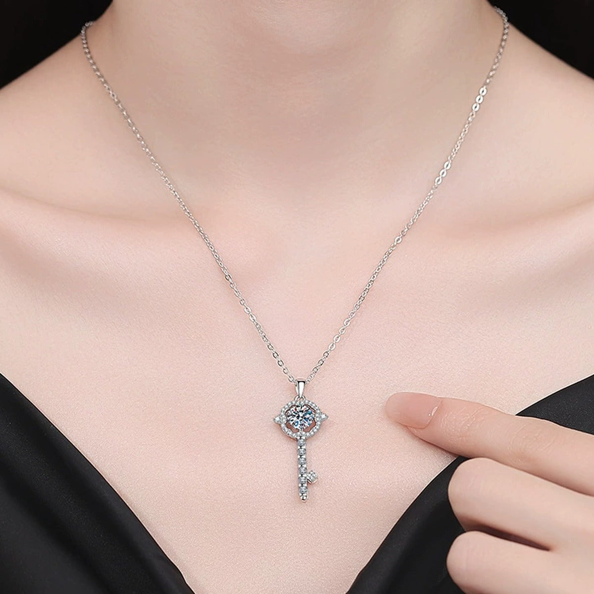 Linear Drop Moissanite Pendant Necklace with Cubic Zirconia in Platinum-Plated S925 Sterling Silver worn on neckline by model
