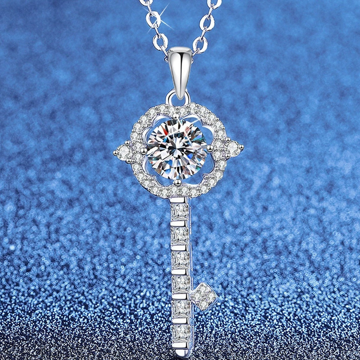 Linear Drop Moissanite Pendant Necklace with Cubic Zirconia in Platinum-Plated S925 Sterling Silver blue background angled view