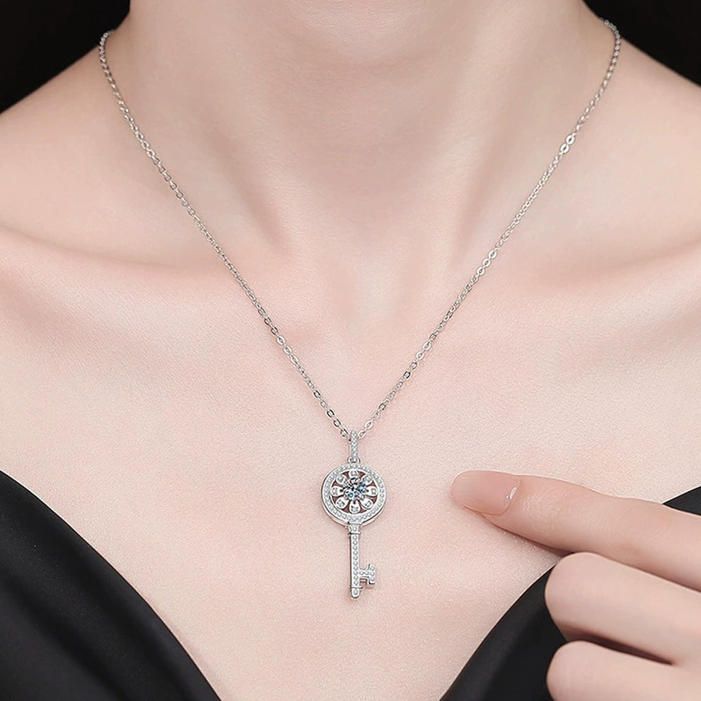 Key Moissanite Pendant Necklace with Cubic Zirconia in Platinum-Plated S925 Sterling Silver worn on neckline by model
