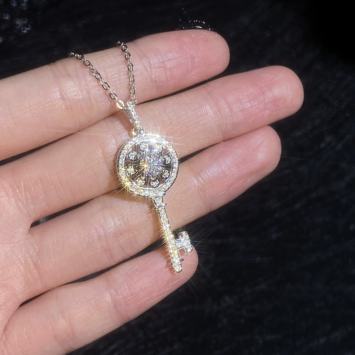 Key Moissanite Pendant Necklace with Cubic Zirconia in Platinum-Plated S925 Sterling Silver worn on neckline by model