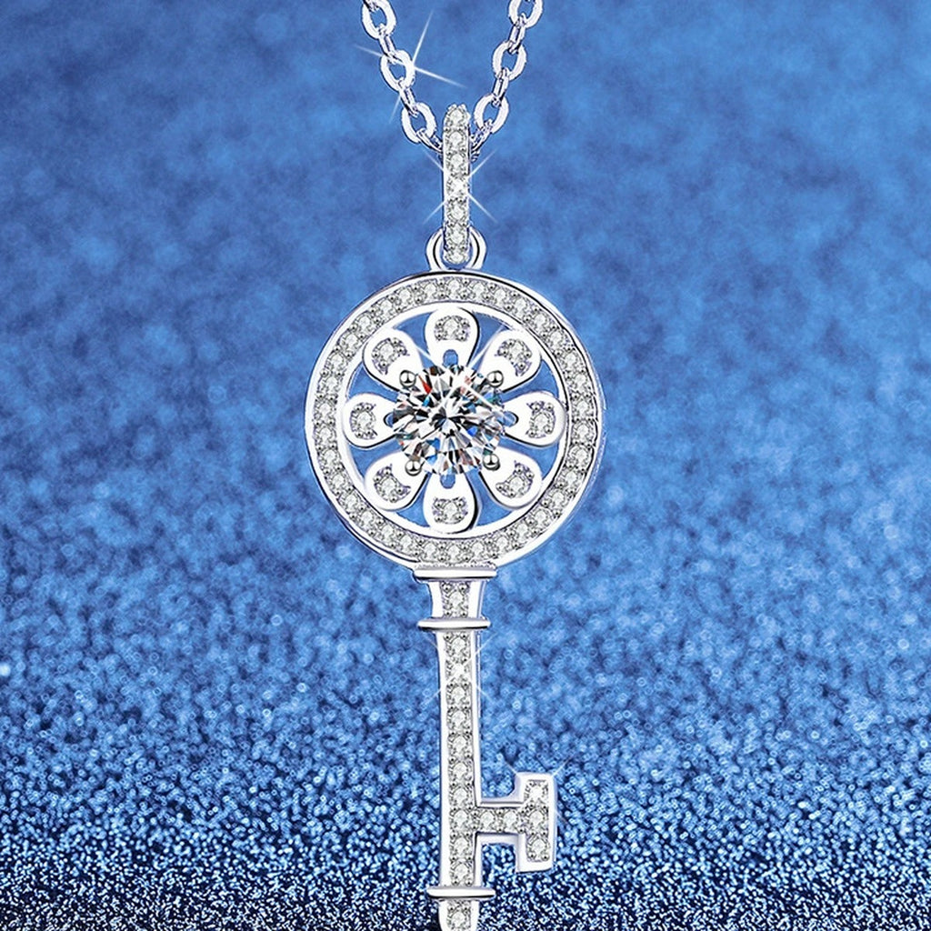 Key Moissanite Pendant Necklace with Cubic Zirconia in Platinum-Plated S925 Sterling Silver blue background angled view