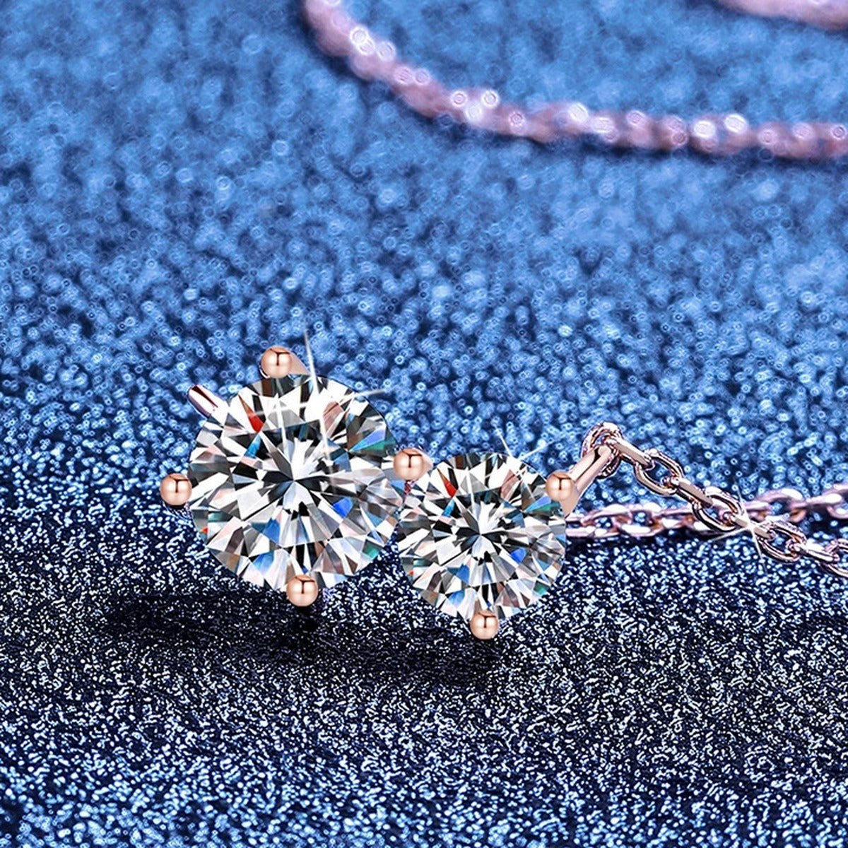 Three-Stone Moissanite Collar Necklace in S925 Sterling Silver blue background angled view