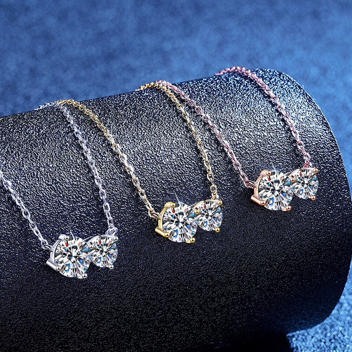 Three-Stone Moissanite Collar Necklace in S925 Sterling Silver blue background styling view