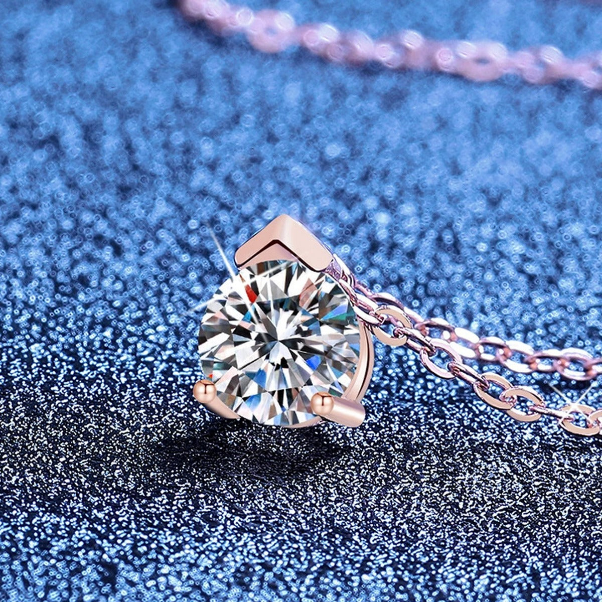 Solitaire Moissanite Collar Necklace in S925 Sterling Silver blue background close-up view