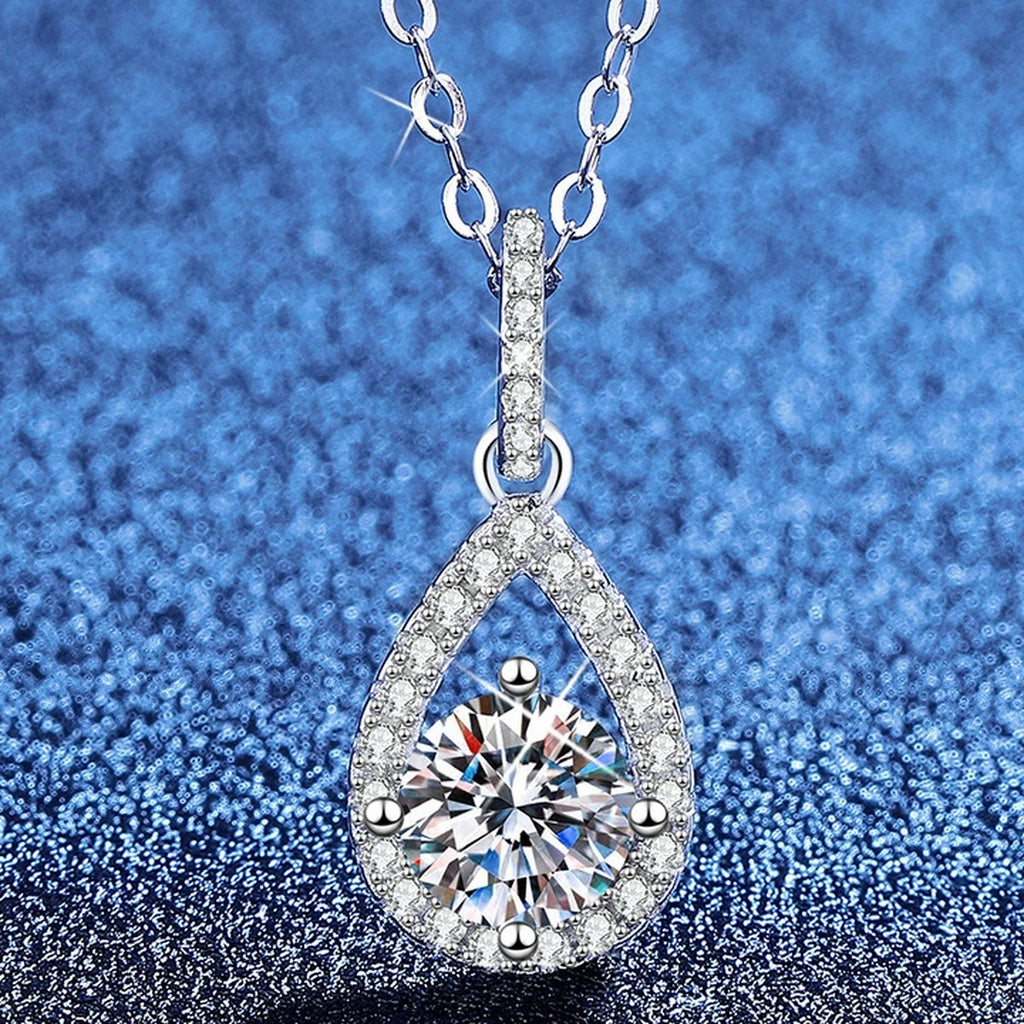 Pear Drop Moissanite Pendant Necklace with Cubic Zirconia in Platinum-Plated S925 Sterling Silver blue background product view