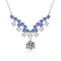 Blue Accent Graduated Moissanite Drop Necklace with Cubic Zirconia in Platinum-Plated S925 Sterling Silver on clean white background showing the graduated drop necklace with blue accent stones and a round moissanite drop