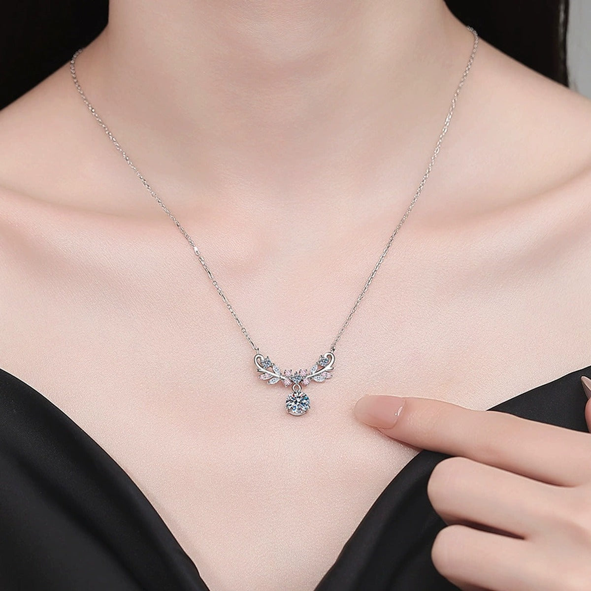 Pink Accent Wing Moissanite Pendant Necklace with Cubic Zirconia in Platinum-Plated S925 Sterling Silver worn on neckline by model