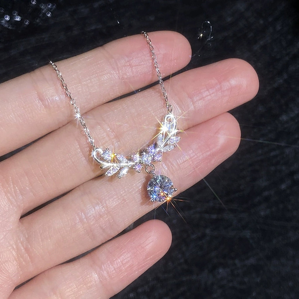 Pink Accent Wing Moissanite Pendant Necklace with Cubic Zirconia in Platinum-Plated S925 Sterling Silver close-up product detail view