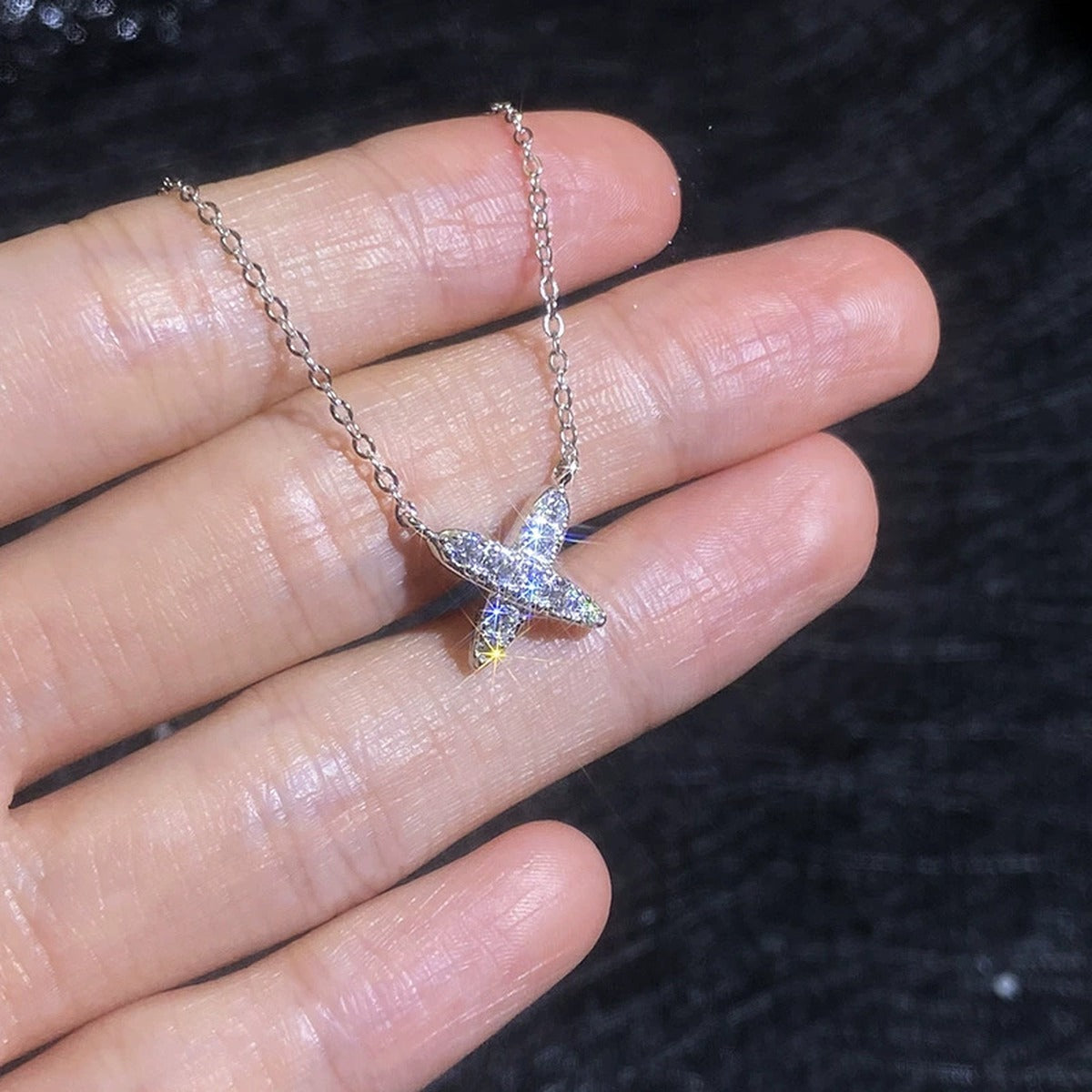 X Motif Moissanite Pendant Necklace in Platinum-Plated S925 Sterling Silver close-up product detail view