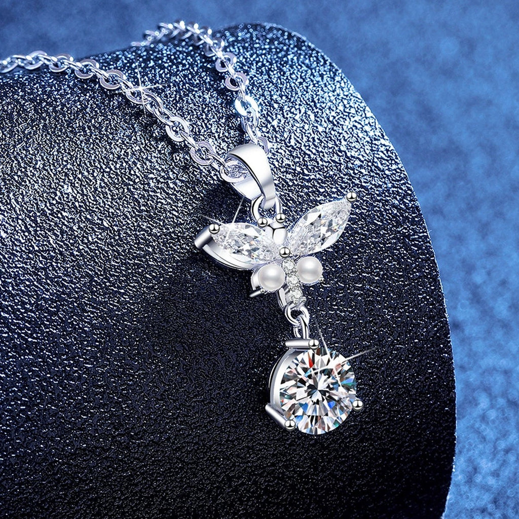 Wing Pearl Moissanite Pendant Necklace with Cubic Zirconia in Platinum-Plated S925 Sterling Silver blue background angled view