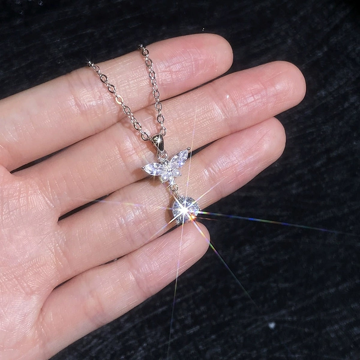 Wing Pearl Moissanite Pendant Necklace with Cubic Zirconia in Platinum-Plated S925 Sterling Silver close-up product detail view