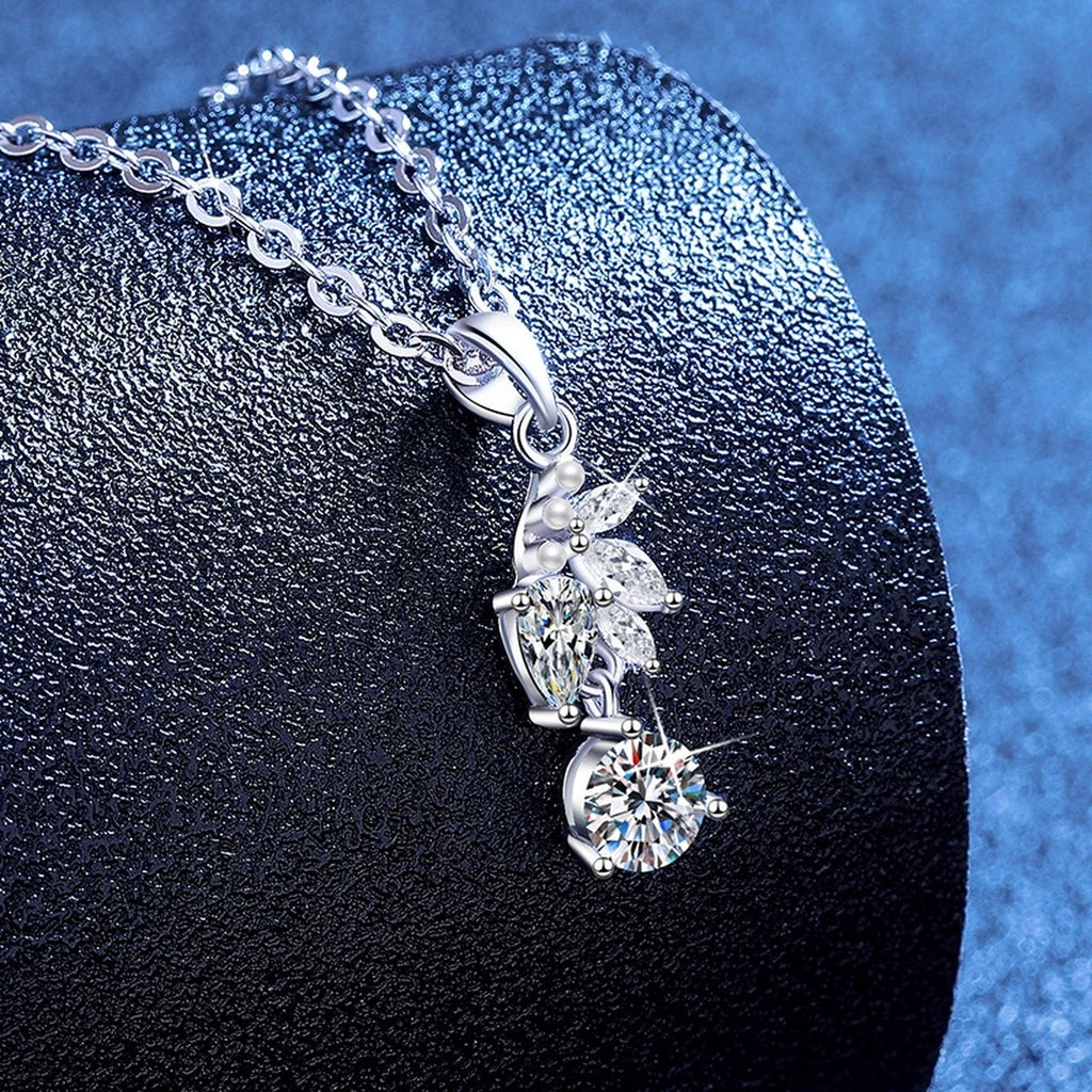 Leaf Pearl Moissanite Pendant Necklace with Cubic Zirconia in Platinum-Plated S925 Sterling Silver blue background angled view