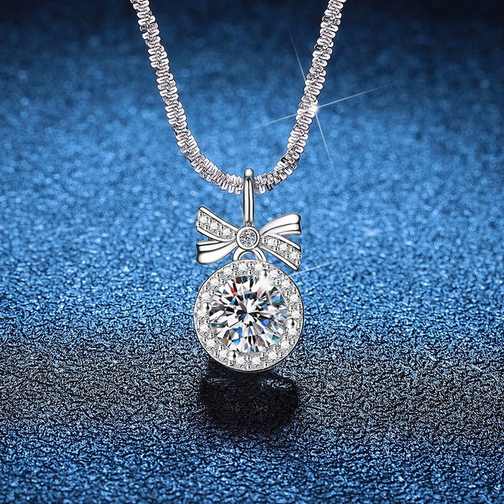 Bow Moissanite Pendant Necklace with Cubic Zirconia in Platinum-Plated S925 Sterling Silver blue background product view