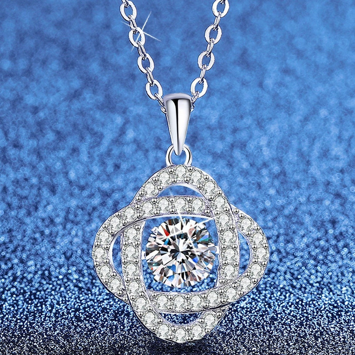 Cushion Medallion Moissanite Pendant Necklace with Cubic Zirconia in Platinum-Plated S925 Sterling Silver blue background angled view