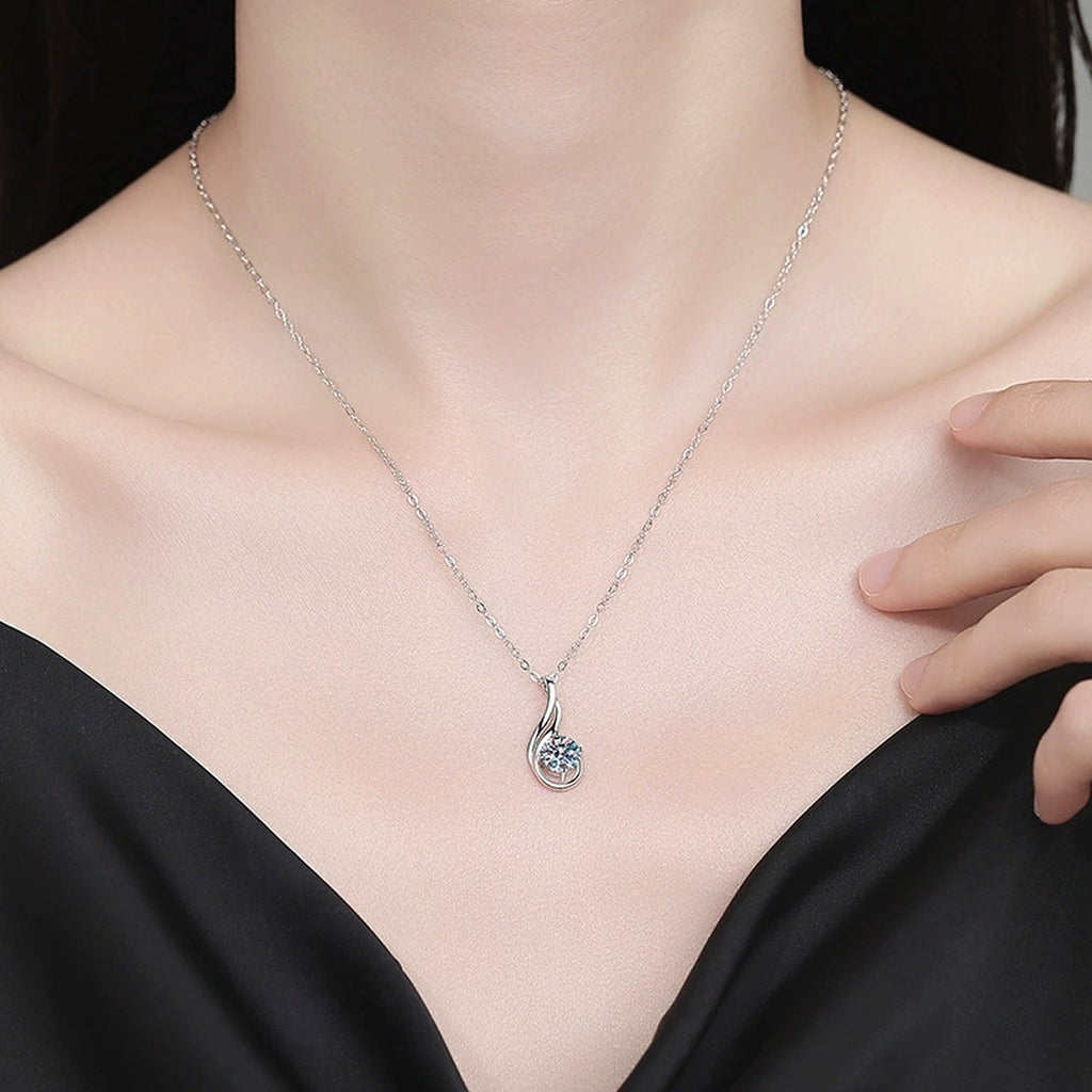 Flame Teardrop Moissanite Pendant Necklace in Platinum-Plated S925 Sterling Silver worn on neckline by model